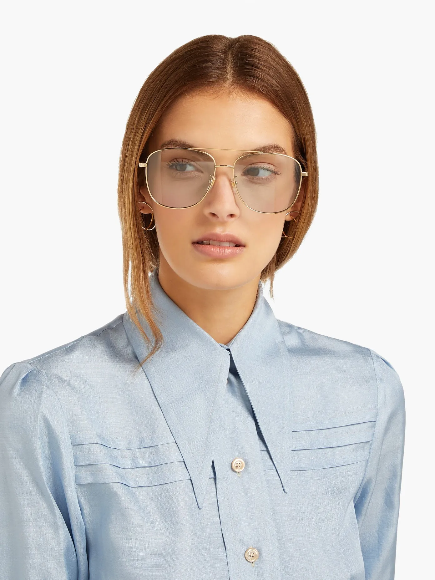 Gucci Metal Framed Navigator Sunglasses in Gold