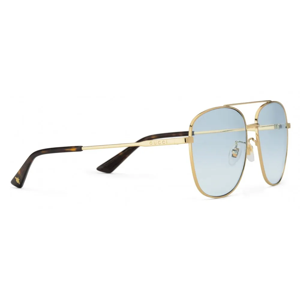 Gucci Metal Framed Navigator Sunglasses in Gold